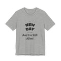 New Day Tee — "And I'm Still Alive" Inspirational Graphic T-Shirt