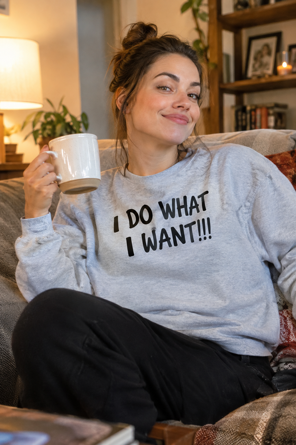 Woman relaxing on a couch wearing I Do What I Want crewneck